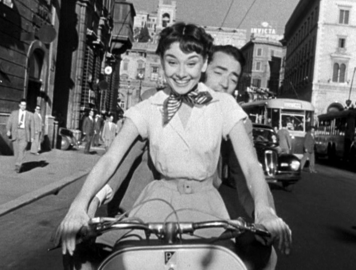 By Trailer screenshot Licencing information :http://web.archive.org/web/20080321033709/http://www.sabucat.com/?pg=copyright and http://www.creativeclearance.com/guidelines.html#D2 (Roman Holiday trailer) [Public domain], via Wikimedia Commons